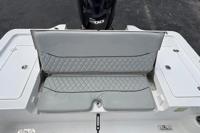 Slide: The Image of 2016 Sportsman Tournament 234 Bay Boat with cushioned seating and powerful engine. - 15