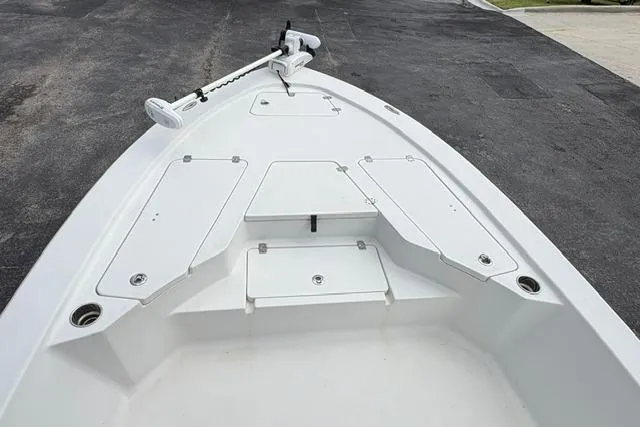 Slide: The Image of 2016 Sportsman Tournament 234 Bay Boat deck with storage compartments and trolling motor. - 18