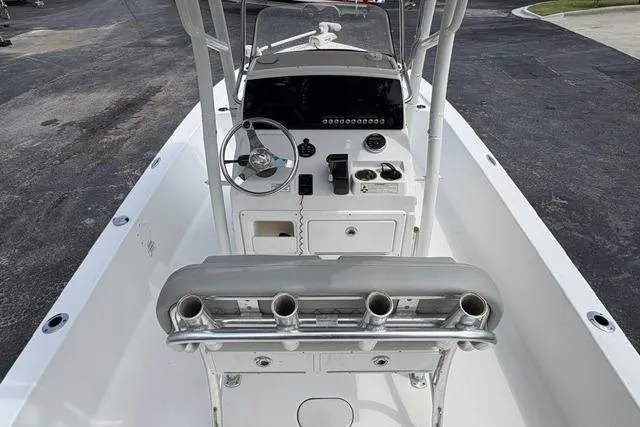 Slide: The Image of 2016 Sportsman Tournament 234 Bay Boat interior with steering console and rod holders. - 19