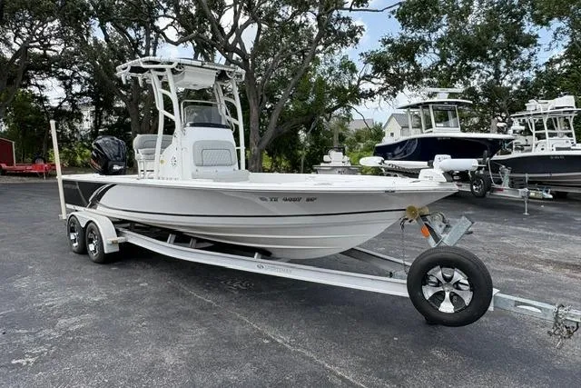 Slide: The Image of 2016 Sportsman Tournament 234 Bay Boat on trailer, parked outdoors. - 2