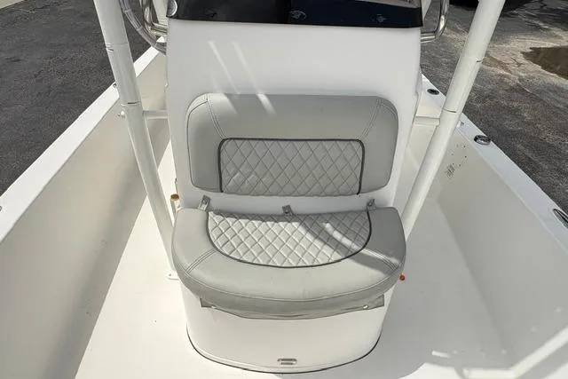 Slide: The Image of 2016 Sportsman Tournament 234 Bay Boat with cushioned seating and white interior. - 20