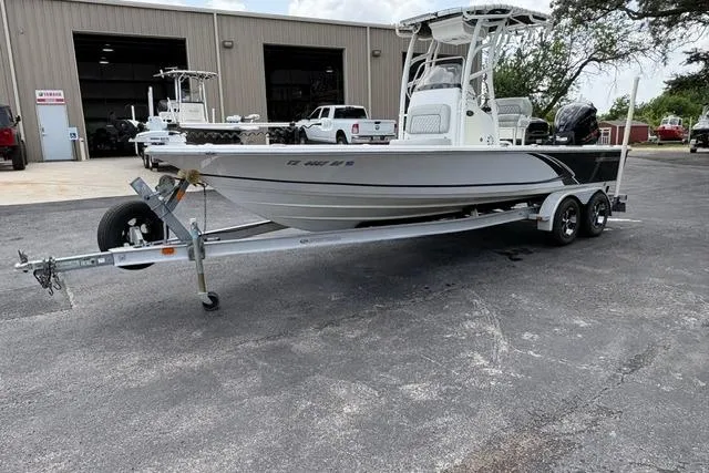 Slide: The Image of 2016 Sportsman Tournament 234 Bay Boat on trailer outside a warehouse. - 4