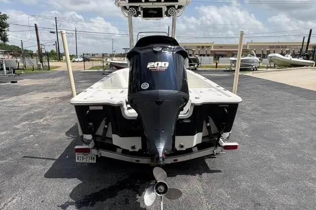 Slide: The Image of 2016 Sportsman Tournament 234 Bay Boat with 200 HP engine, parked outdoors. - 8