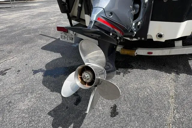 Slide: The Image of 2016 Sportsman Tournament 234 Bay Boat propeller and motor detail on pavement. - 9