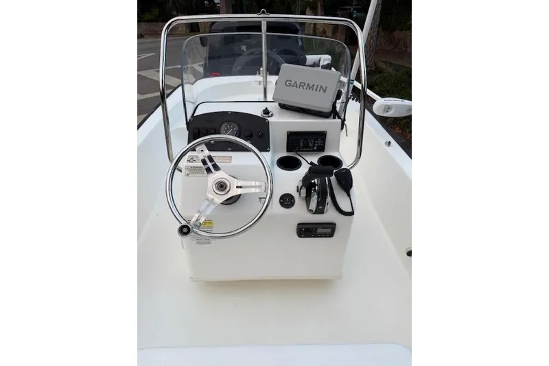 Slide: The Image of 2016 Boston Whaler 150 Montauk boat console with Garmin GPS and steering wheel. - 15