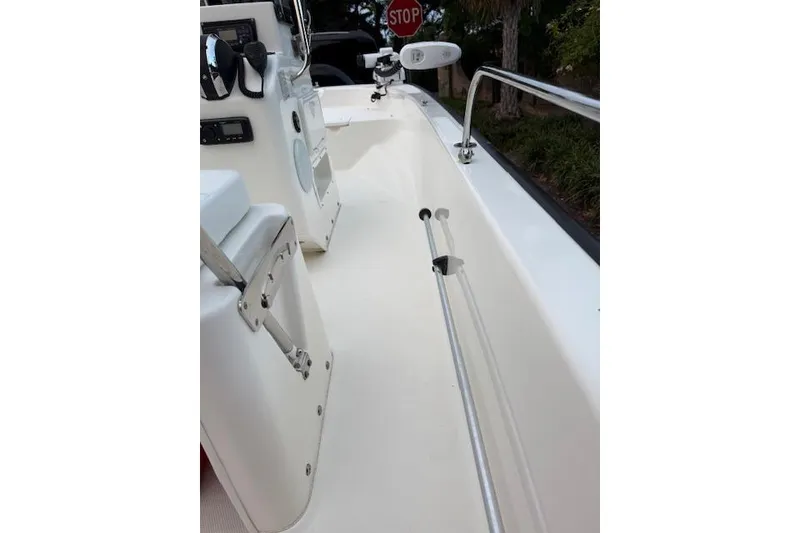 Slide: The Image of 2016 Boston Whaler 150 Montauk boat interior with steering console and seating. - 20