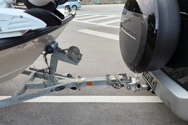 Slide: The Image of Trailer hitch connecting a 2016 Boston Whaler 150 Montauk boat to a vehicle. - 33