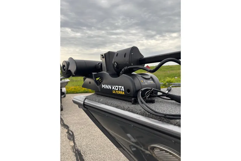 Slide: The Image of Minn Kota Ulterra motor on 2018 Lund 1775 Impact XS boat, cloudy sky background. - 10