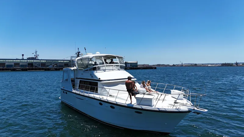Slide: The Image of A luxury motor yacht on the water with people relaxing on the deck. - 10