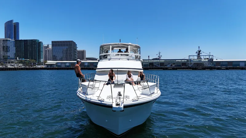 Slide: The Image of People relaxing on the deck of a large yacht in the harbor. - 11