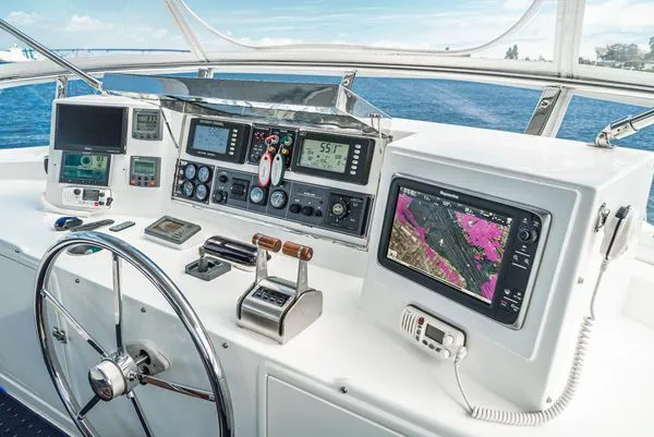 Slide: The Image of Helm of a yacht with modern navigation equipment and a large steering wheel. - 15