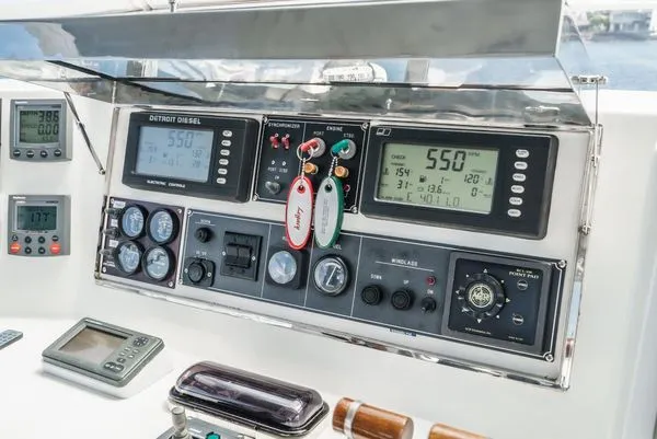 Slide: The Image of Dashboard with various instruments and displays on a boat. - 18