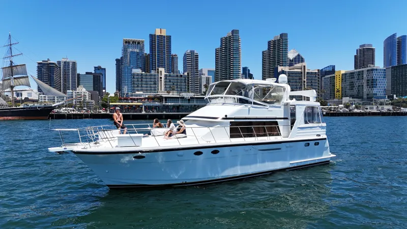 Slide: The Image of 2002 Jefferson Rivanna 50 Sundeck MY in an urban waterfront setting. - 2