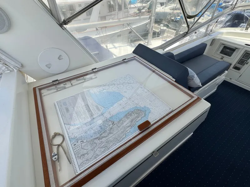 Slide: The Image of Chart on a table in the helm area of a yacht. - 22