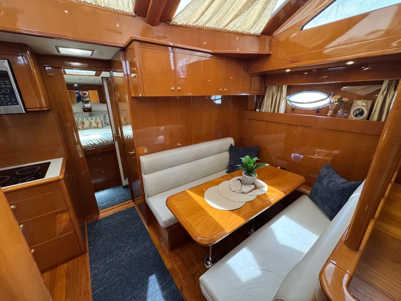 Slide: The Image of Interior of the 2002 Jefferson Rivanna 50 Sundeck MY with dining area and kitchen. - 35