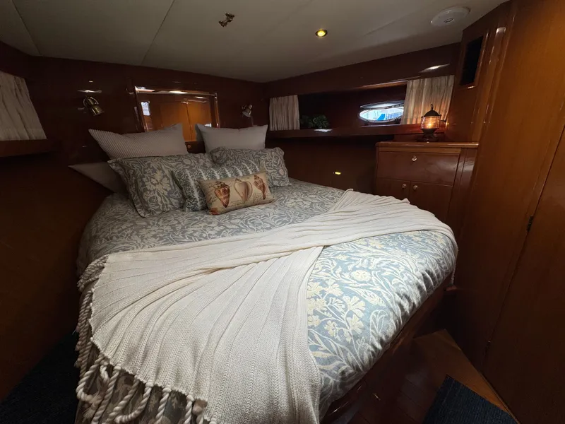 Slide: The Image of Luxurious bedroom with king-size bed and elegant bedding in a yacht. - 41