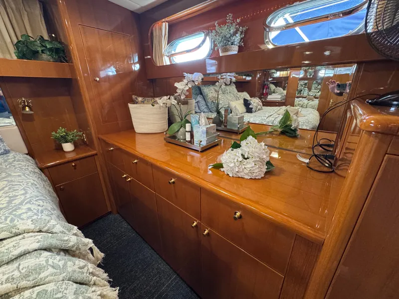 Slide: The Image of Interior of a luxurious cabin with wood paneling, mirrors, and decorative plants. - 49