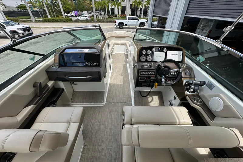 Slide: The Image of 2018 Formula 290 Bowrider interior with modern dashboard and seating, showcasing luxury design. - 12