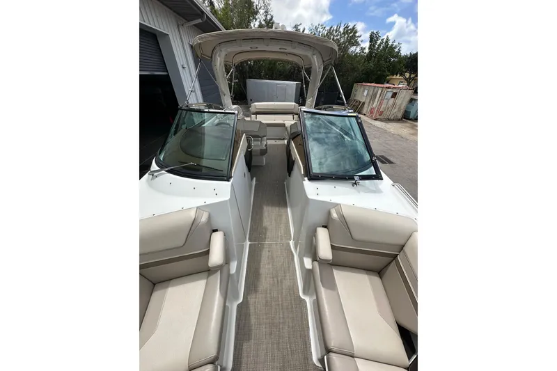 Slide: The Image of 2018 Formula 290 Bowrider boat interior with beige seating and open cockpit. - 17