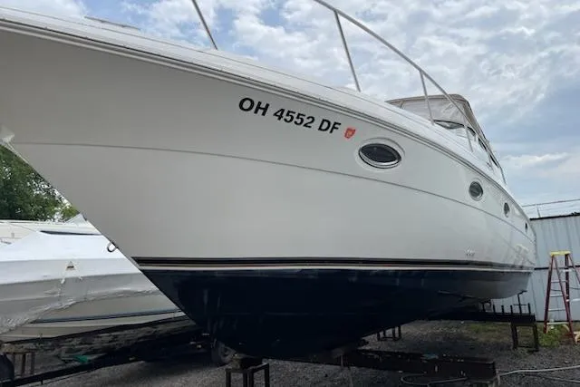 The Image of 2002 Cruisers Yachts 3372 Express boat on stands, registration OH 4552 DF. - 1