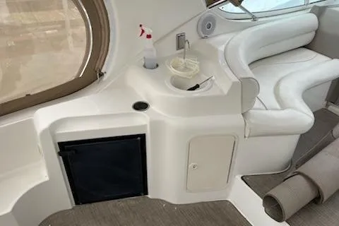 Slide: The Image of 2002 Cruisers Yachts 3372 Express interior with seating and storage. - 6