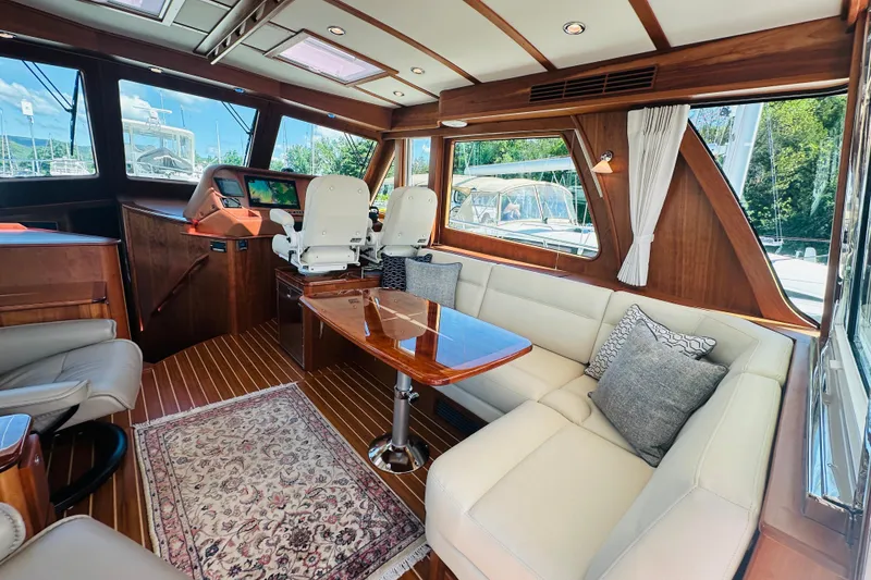 Slide: The Image of Luxurious interior of 2025 Sabre 48 Salon Express yacht with elegant seating and wood finishes. - 14