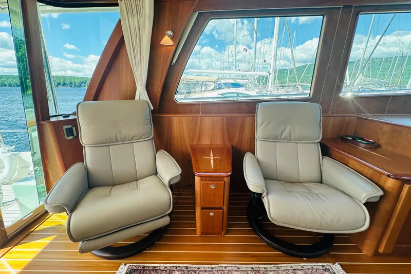 Slide: The Image of Luxurious interior of 2025 Sabre 48 Salon Express yacht with plush seating and scenic views. - 16