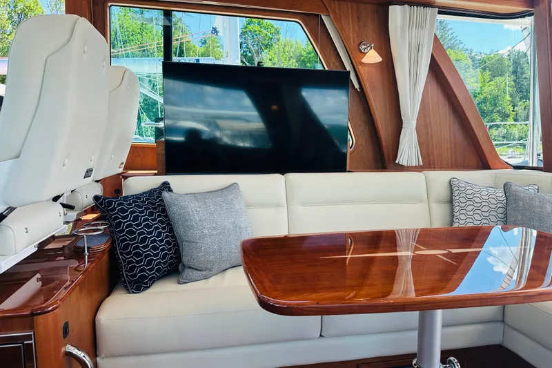 Slide: The Image of Luxurious interior of 2025 Sabre 48 Salon Express yacht with elegant seating and wooden table. - 20