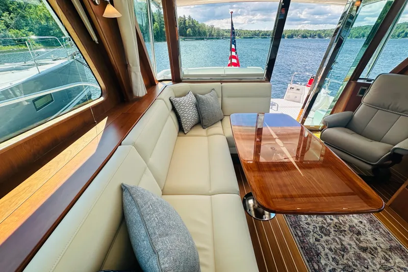Slide: The Image of Luxurious interior of 2025 Sabre 48 Salon Express yacht with elegant seating and scenic water view. - 21