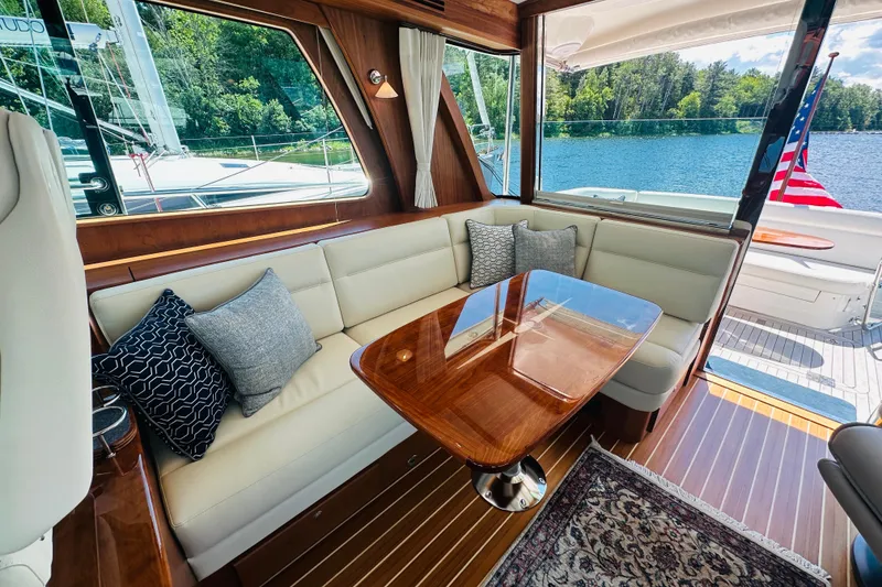 Slide: The Image of Luxurious interior of 2025 Sabre 48 Salon Express yacht with elegant seating and scenic water view. - 33