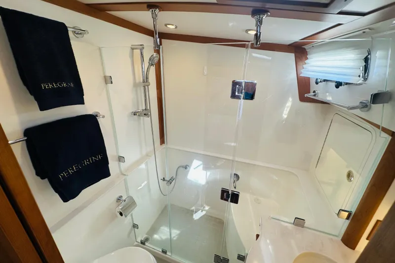Slide: The Image of Luxurious bathroom in 2025 Sabre 48 Salon Express yacht with glass shower enclosure. - 49