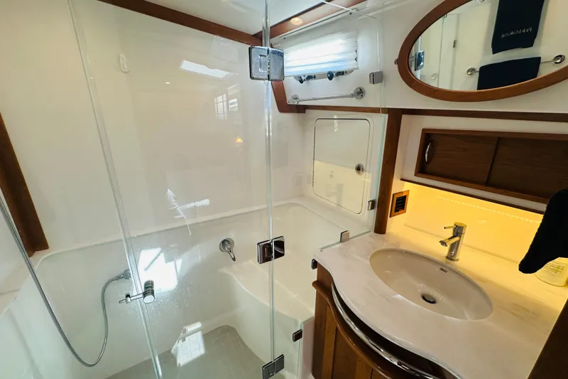 Slide: The Image of Luxurious bathroom in 2025 Sabre 48 Salon Express yacht with modern fixtures and elegant design. - 50