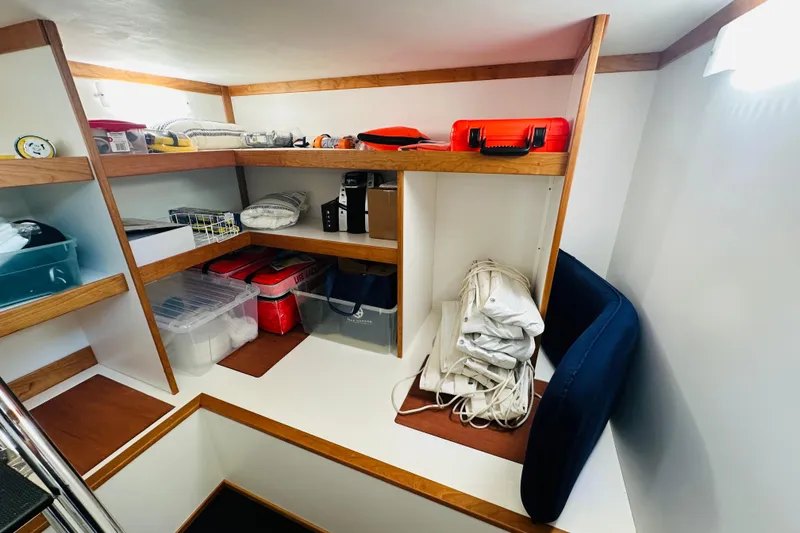 Slide: The Image of Storage area in 2025 Sabre 48 Salon Express yacht with organized shelves and equipment. - 61