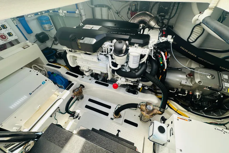 Slide: The Image of Engine room of 2025 Sabre 48 Salon Express, featuring advanced marine technology and equipment. - 66