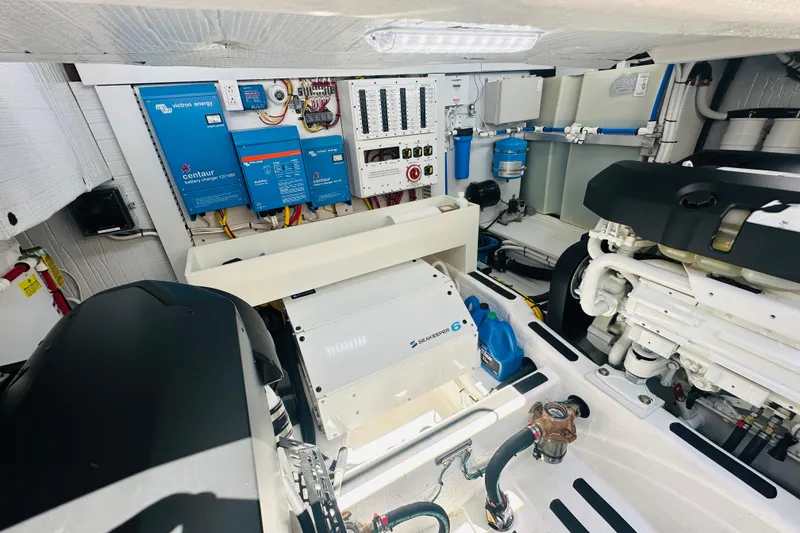 Slide: The Image of Engine room of 2025 Sabre 48 Salon Express, featuring advanced electrical systems and components. - 67