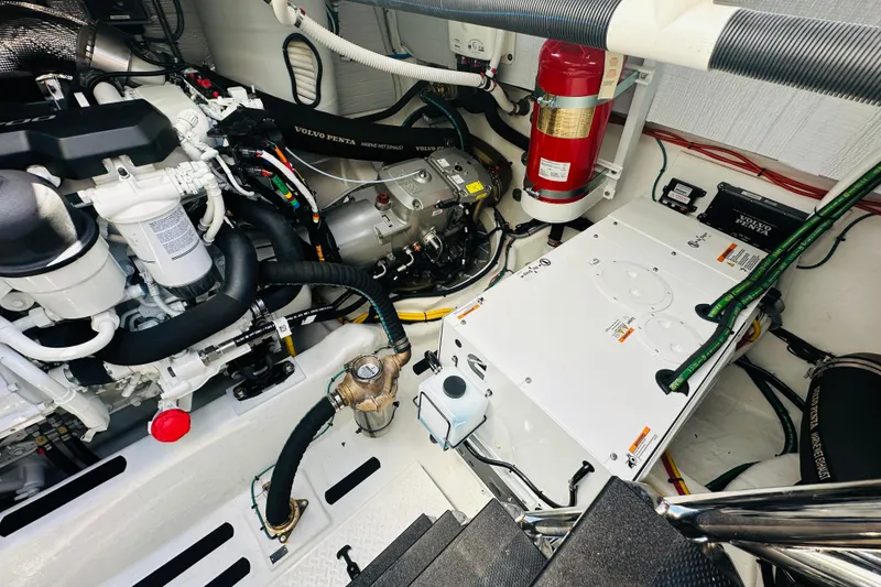 Slide: The Image of Engine room of 2025 Sabre 48 Salon Express with Volvo Penta components and safety equipment. - 68