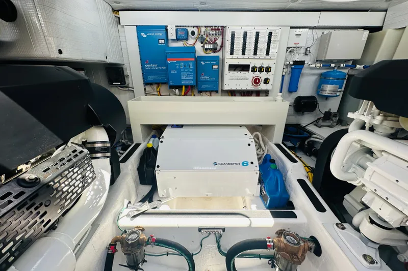 Slide: The Image of Engine room of 2025 Sabre 48 Salon Express with Seakeeper 6 and electrical systems. - 69