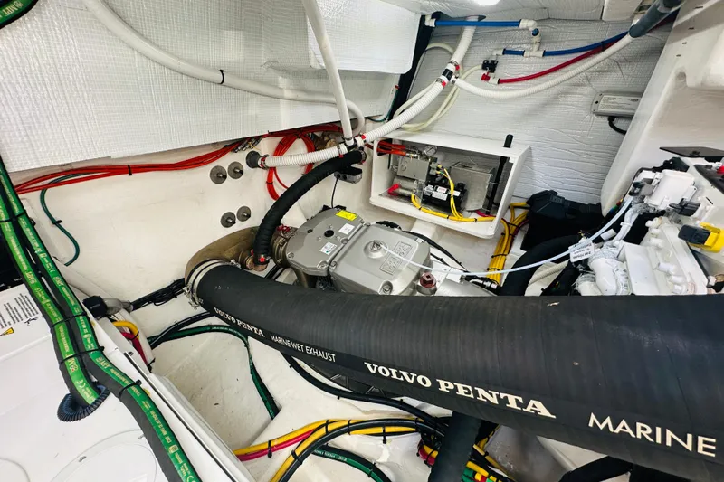 Slide: The Image of Engine room of 2025 Sabre 48 Salon Express with Volvo Penta marine exhaust system. - 76