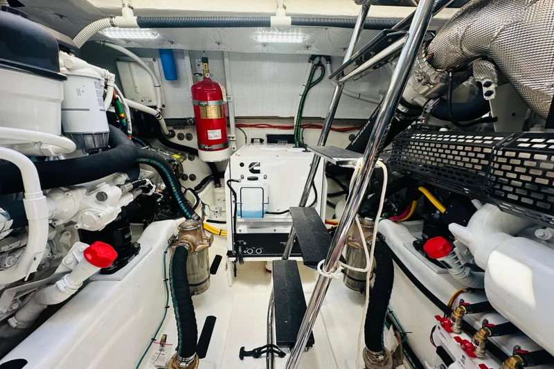 Slide: The Image of Engine room of 2025 Sabre 48 Salon Express, featuring modern equipment and organized layout. - 77
