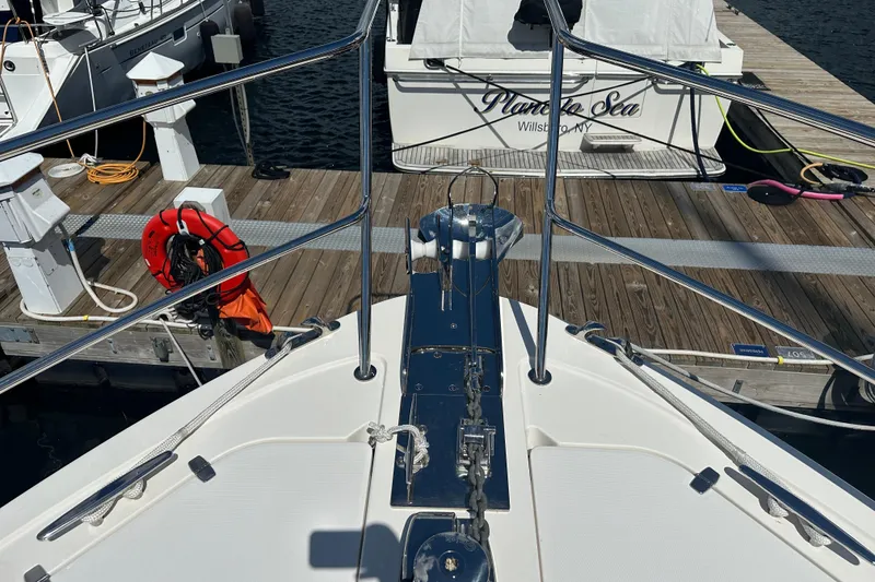 Slide: The Image of Bow view of 2025 Sabre 48 Salon Express yacht docked at marina. - 84