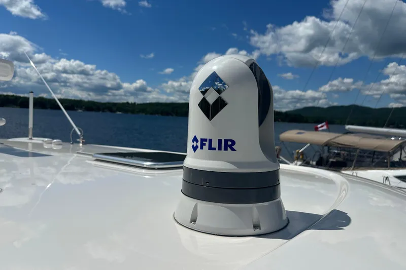 Slide: The Image of FLIR camera on 2025 Sabre 48 Salon Express yacht under clear blue sky. - 89