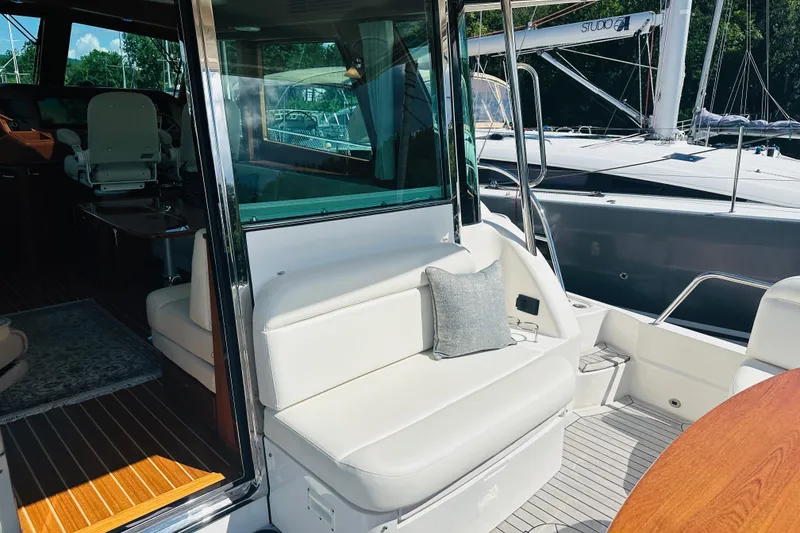 Slide: The Image of 2025 Sabre 48 Salon Express yacht interior with plush seating and elegant design. - 9