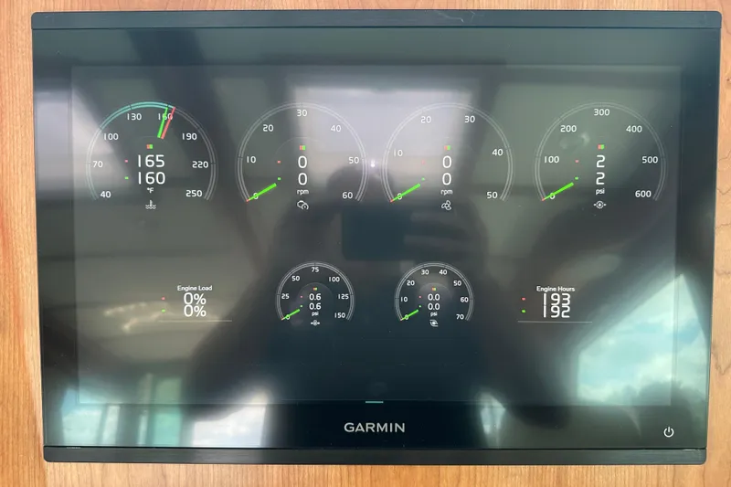 Slide: The Image of Garmin display showing engine metrics for 2025 Sabre 48 Salon Express yacht. - 99