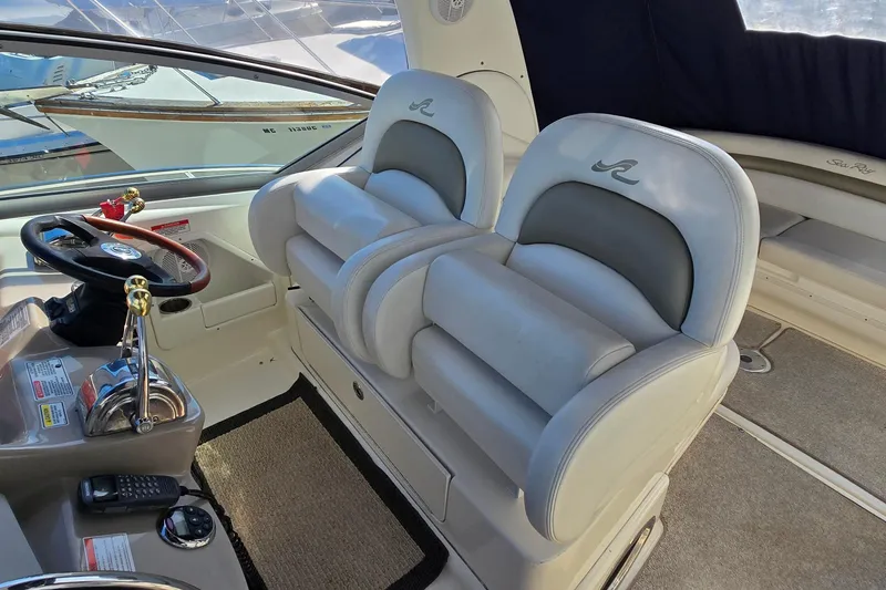 Slide: The Image of Interior of 2007 Sea Ray 340 Sundancer boat with plush seating and helm controls. - 10