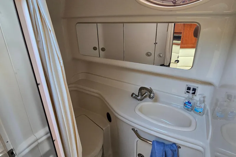 Slide: The Image of Bathroom interior of 2007 Sea Ray 340 Sundancer yacht with sink and mirror. - 21