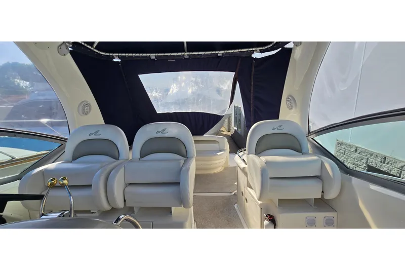 Slide: The Image of Interior of 2007 Sea Ray 340 Sundancer yacht with plush seating and modern design. - 25