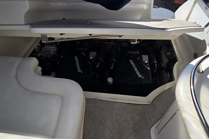 Slide: The Image of Engine compartment of a 2007 Sea Ray 340 Sundancer with Mercury engines visible. - 26