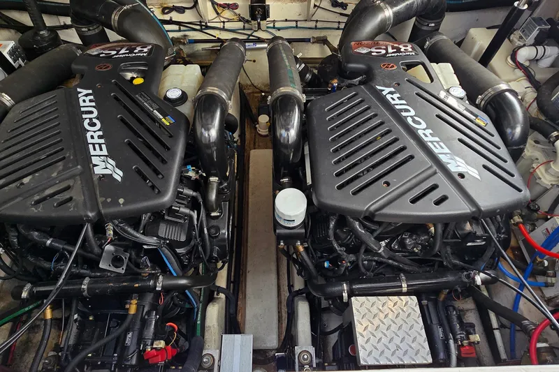 Slide: The Image of Twin Mercury engines in a 2007 Sea Ray 340 Sundancer boat engine compartment. - 27