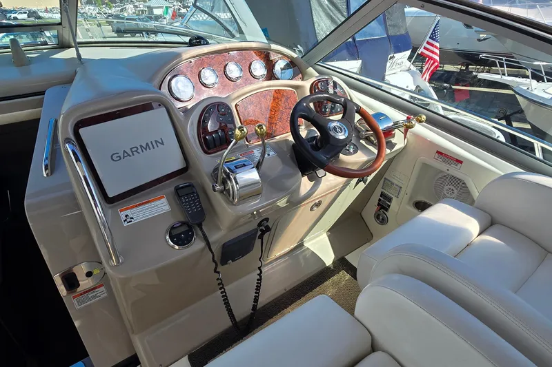 Slide: The Image of 2007 Sea Ray 340 Sundancer helm with Garmin navigation and luxurious leather seating. - 9