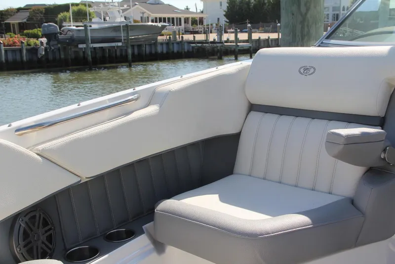 Slide: The Image of Luxurious seating on a 2021 Cobalt 25SC boat, featuring sleek design and waterfront view. - 9